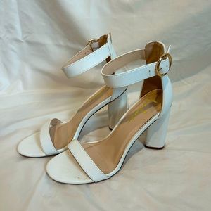 White Lulu’s heels with gold clasp on the ankle. Only worn once.  $10.